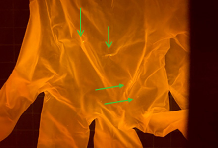 Newly opened gloves under blue light